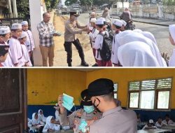 Peduli Kesehatan Pelajar, Dan Pengguna Jalan, Polsek Tanjung Batu Bagikan 150 Masker kepada Siswa SD Negeri 16 Serta Warga Yang Melintas